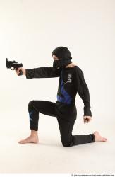 VLASTIMIL KNEELING POSE WITH GUN